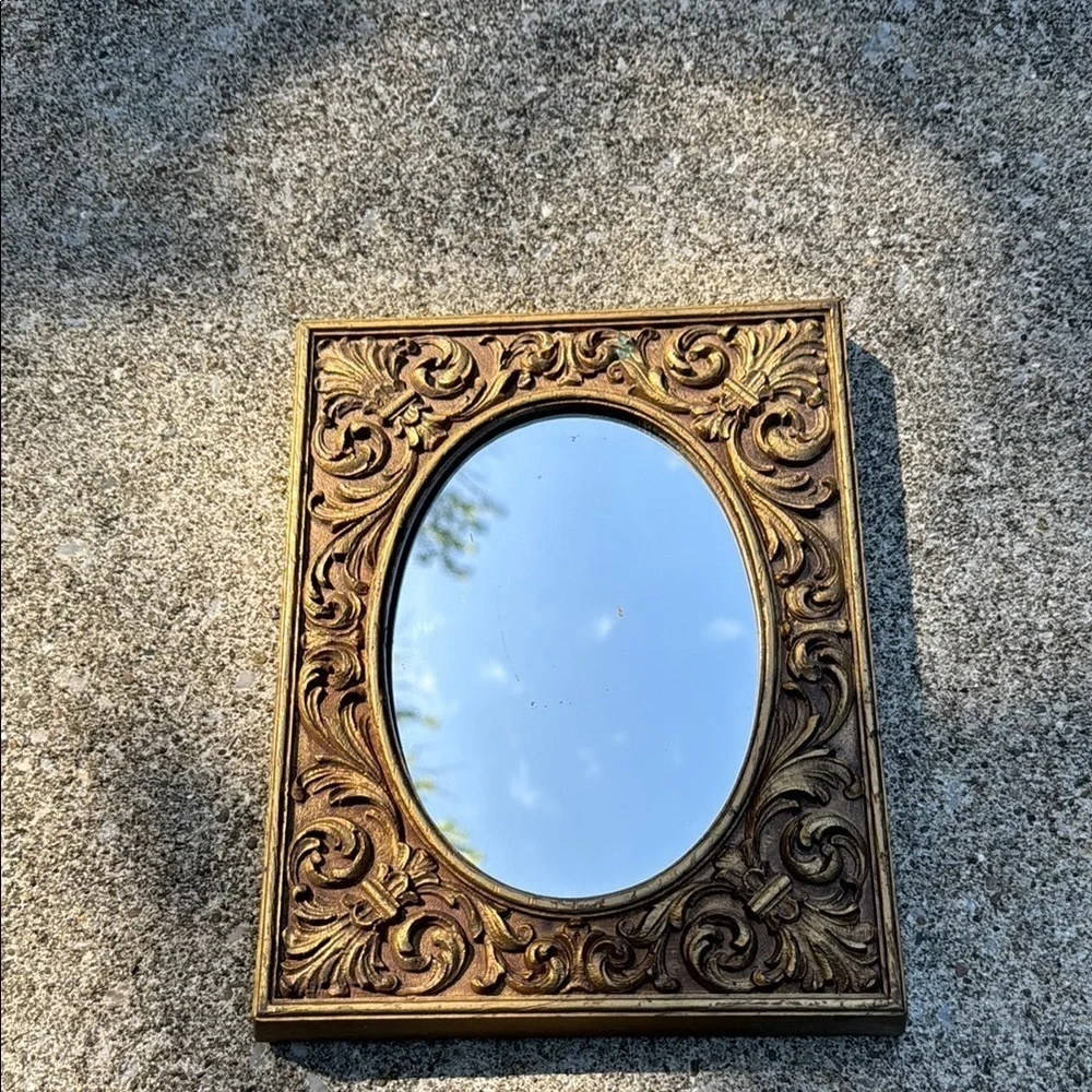 Gold Ornate Mirror with Intricate Scrollwork